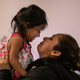 Sandra Sanchez holds Yanela in their basement apartment on Feb. 11. Sanchez said that she and her daughter were initially held by US immigration authorities for 18 days in three separate Texas detention facilities before being released pending an immigration court date.